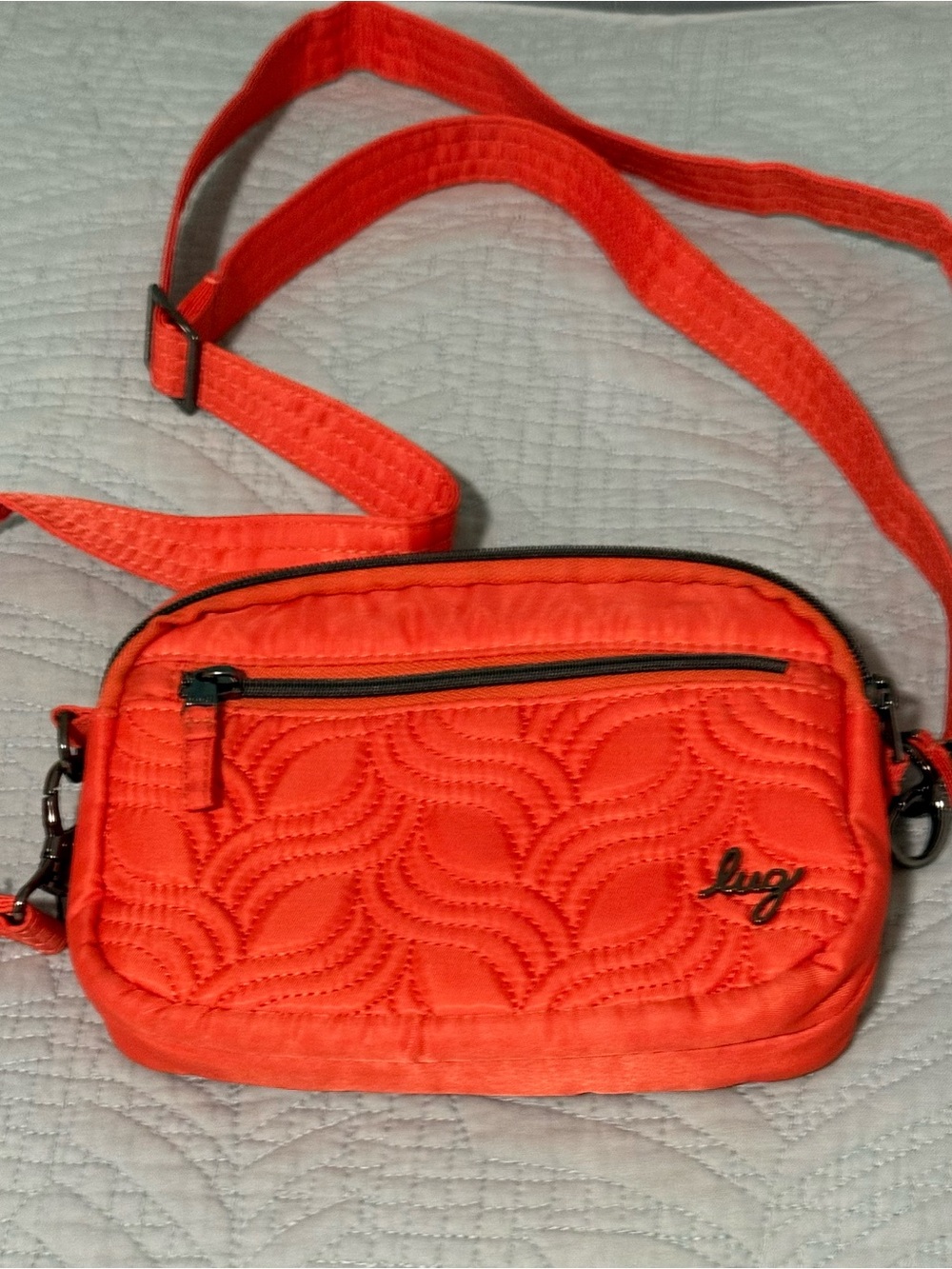 Lug, Super Coupe Convertible Crossbody Bag in a vibrant orange
